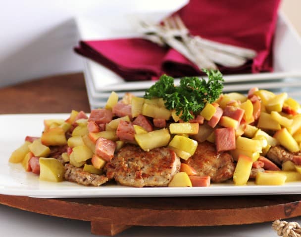 Michael Symon's Pork and Apple Scallopini Michael Symon's Pork and Apple Scallopini on a white serving platter