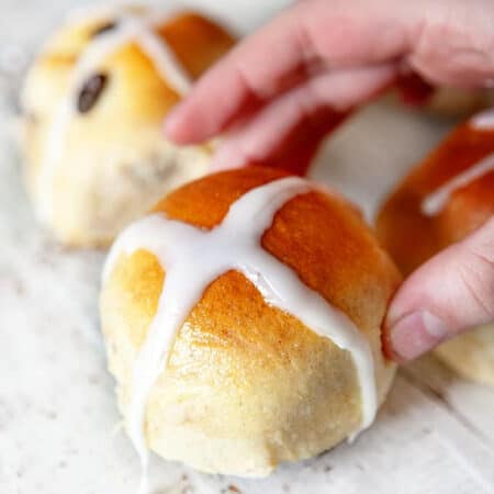 Grabbing a hot crossed bun.