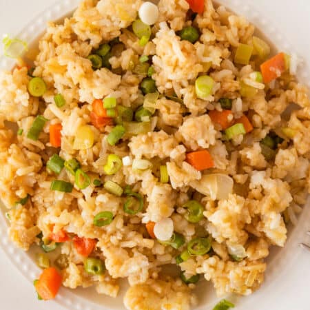 Overhead shot of fried rice on a white plate.