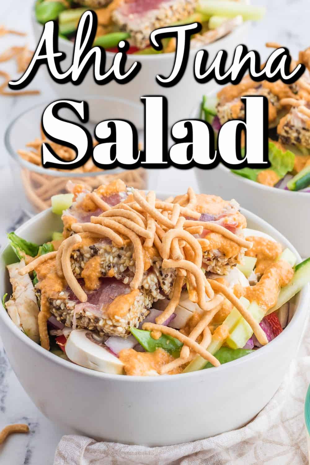 This Ahi Tuna Salad will fill the void for an Asian craving. Gorgeous, slightly seared crusted tuna is on top of a bed of salad with the best Asian dressing around! Finish it off with a little crunch from some chow mein noodles, and you have the perfect salad. Ahi Tuna Salad Pin