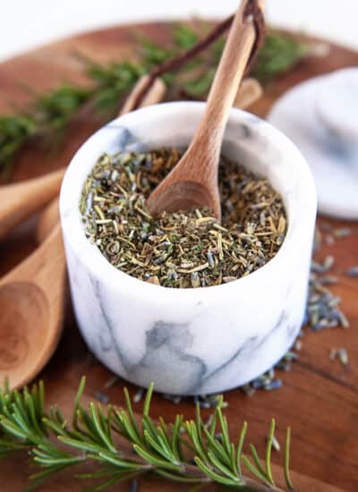Herbs de Provence in a base of a mortar and pestle.