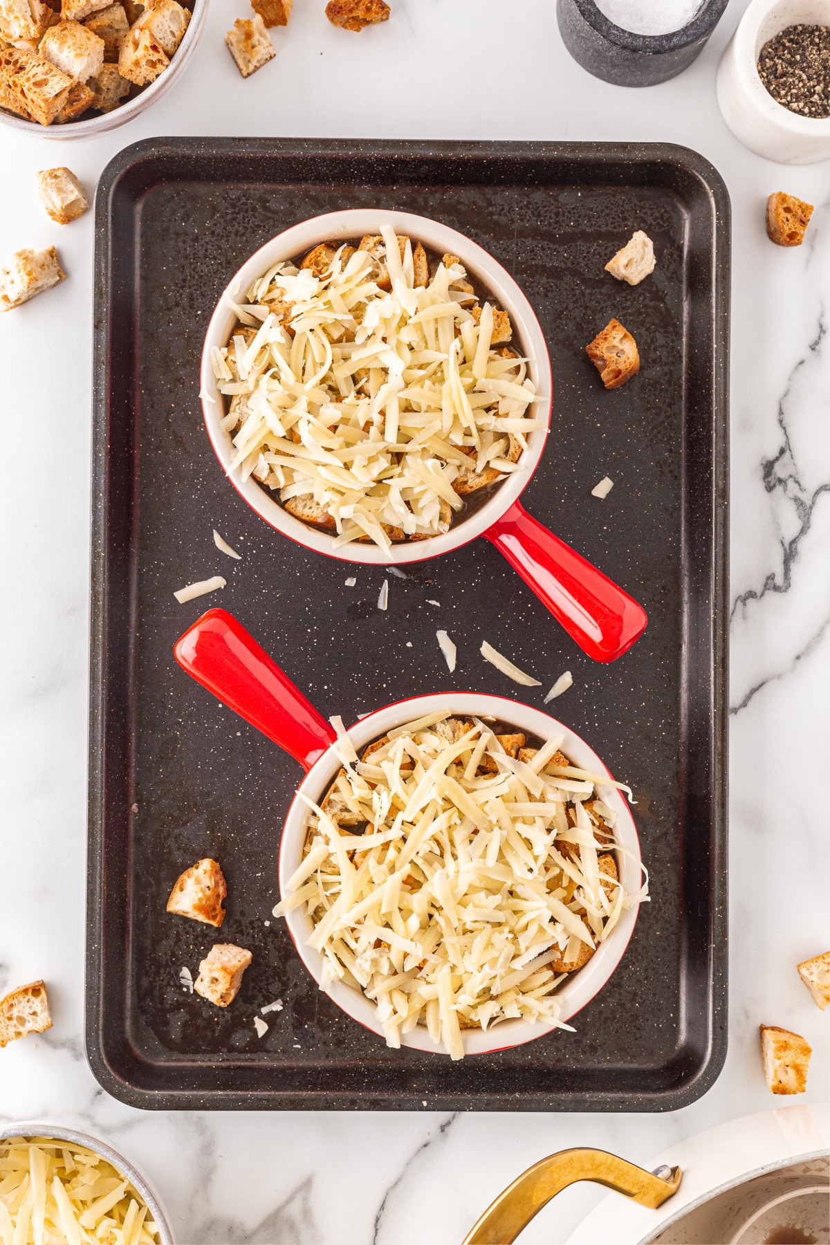 This French Onion Soup for Two is the perfect meal for a cold night in February for Valentine's Day or any night for that matter. Cheese added to the top of the soup.