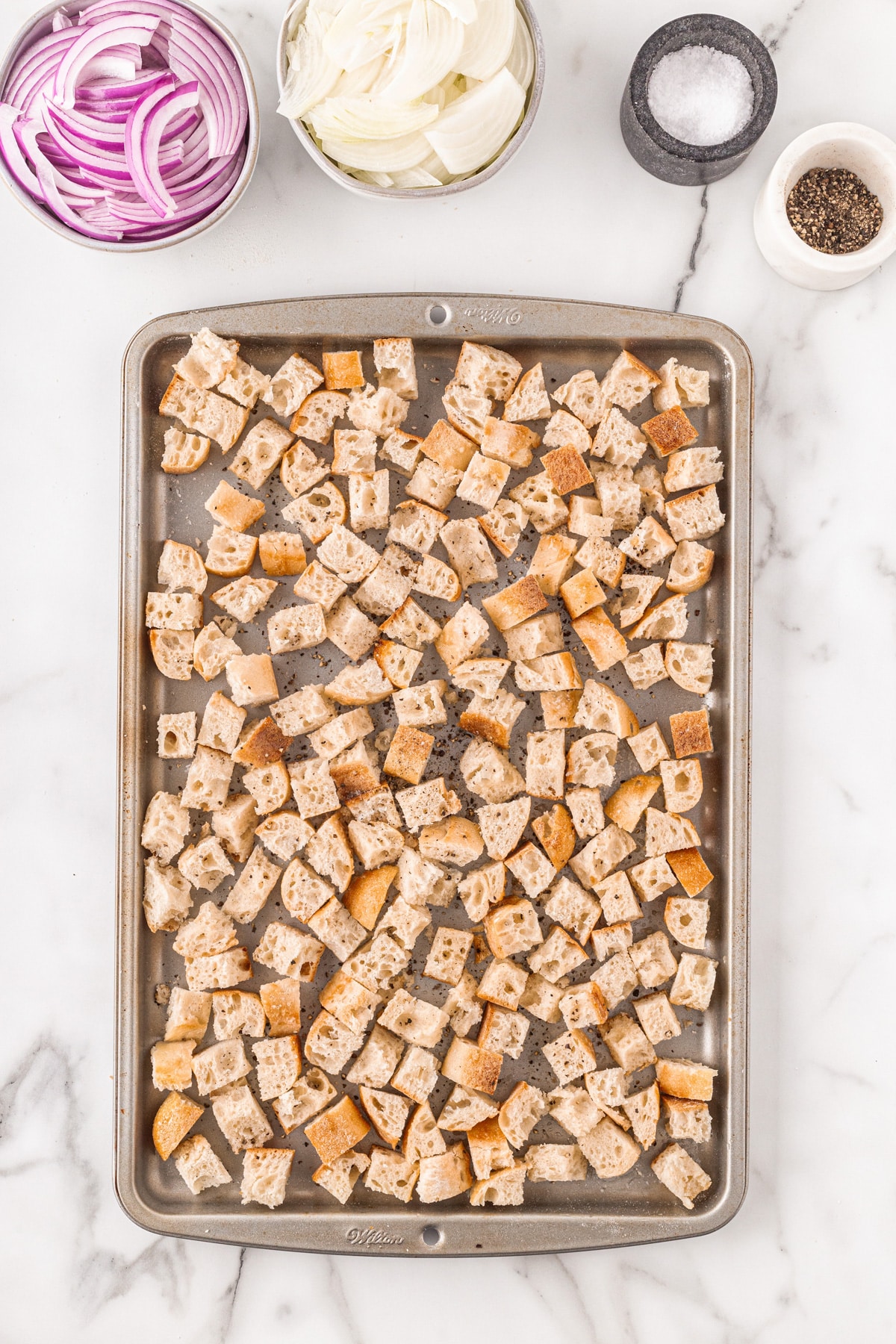 This French Onion Soup for Two is the perfect meal for a cold night in February for Valentine's Day or any night for that matter. Croutons on a baking sheet.