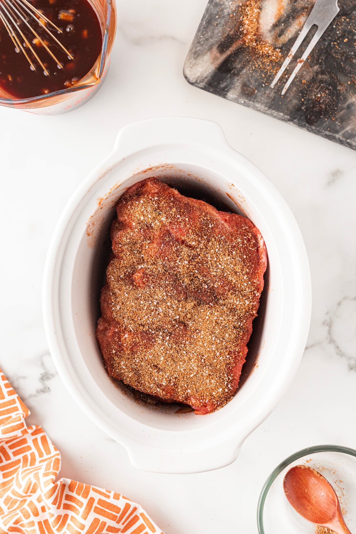 This recipe for divine Slow Cooker BBQ Ribs is so easy to pull together and make the best tender, finger-licking ribs ever. Seasoned ribs in a slow cooker.